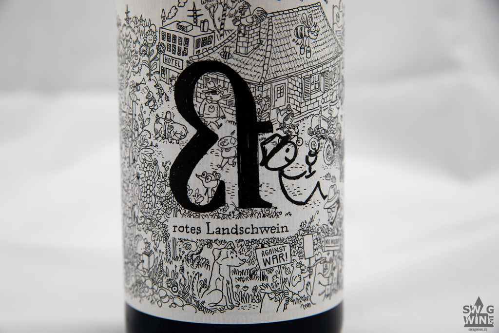 Rosa Landschwein von Lukas Krauß aus der Pfalz Naturwein - Etikett mit Comic Zeichnung Haus mit Garten und Tieren
